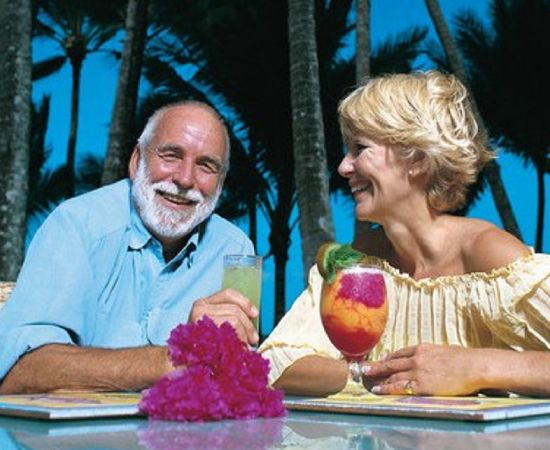 2023-kuranda-luxury-10 a man and a woman sitting on a table