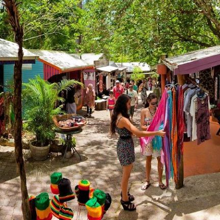 a group of people standing around a table