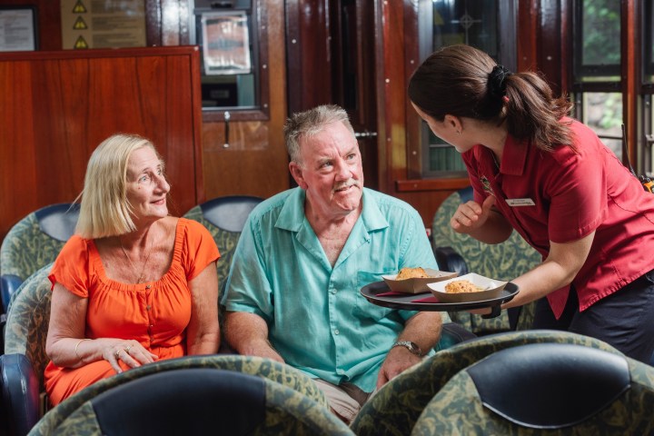 a group of people sitting at a table