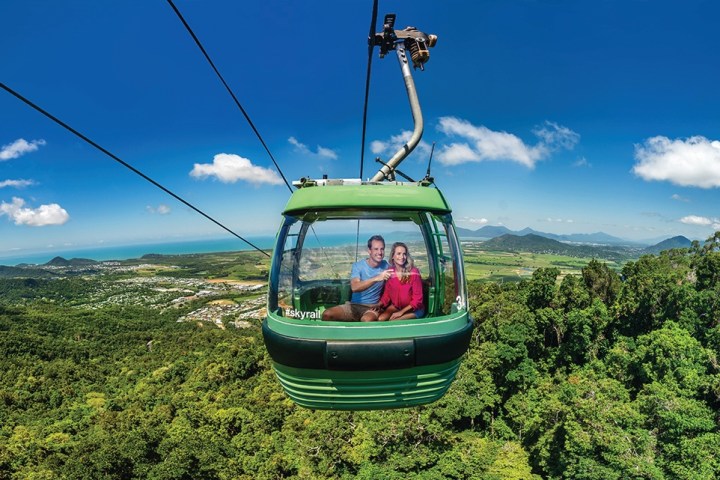 a boat sitting on top of a green field