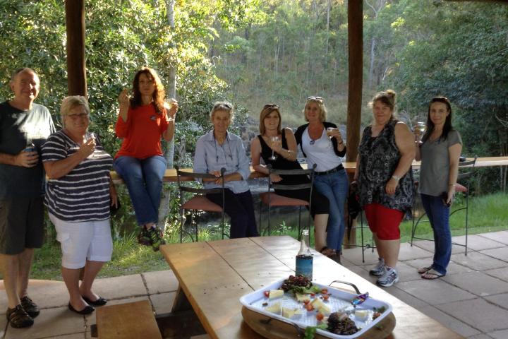 a group of people standing around a table