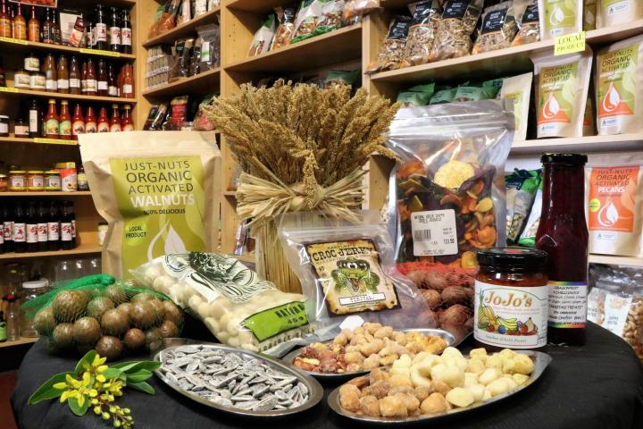 a store filled with lots of different types of food on a table