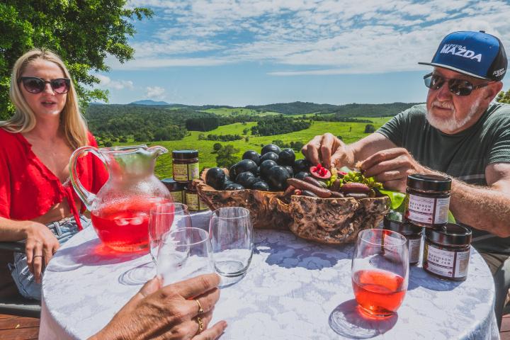 a person holding a hot dog