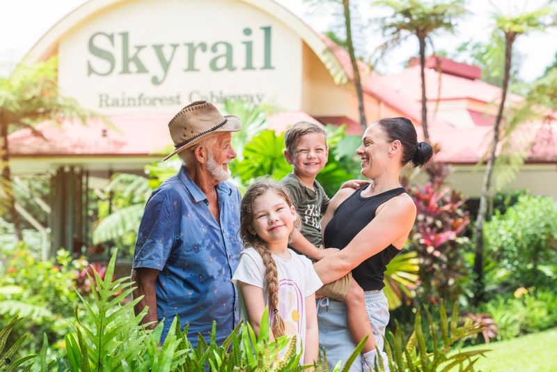 a man and a woman standing in a garden